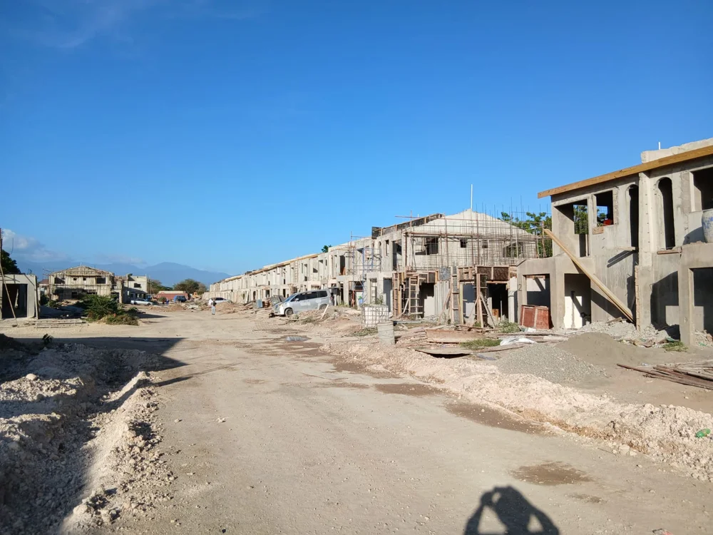 HAJ Housing Development at 3 North, Portmore, St. Catherine — buildings under construction with scaffolding and site access