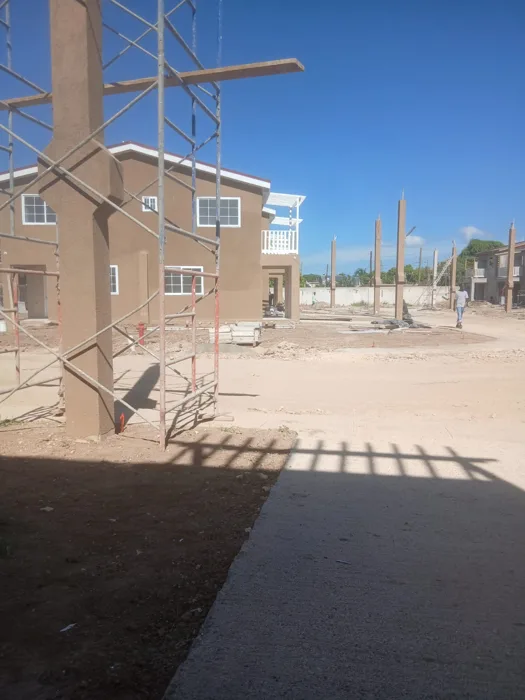 Construction site viewed from a building entrance — HAJ Housing Development, 3 North, Portmore, St. Catherine