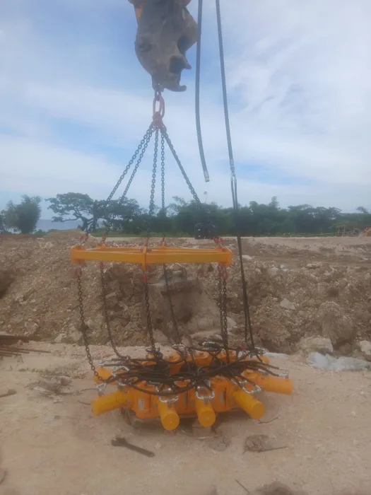 Pile-head breaking equipment positioned by crane — Grand Palladium Hotel Phase 2 expansion